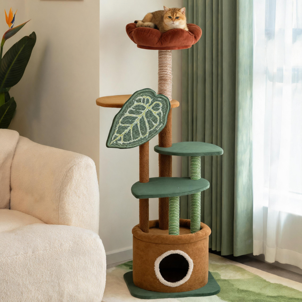 Ginger cat sleeping in the round entrance of the cat tree’s brown plant-pot-style hideaway.