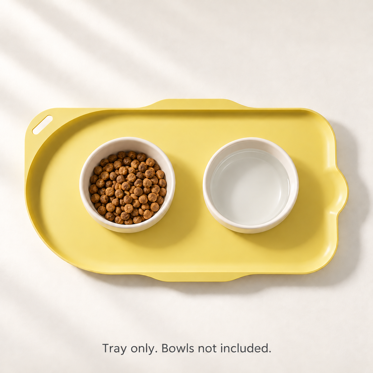 Yellow feeding tray with food and water bowls showing a feeding setup. Tray only; bowls not included.