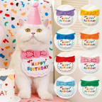 White cat wearing a pink Happy Birthday bib and pom-pom party hat, beside examples of colourful bib designs.